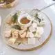 A colorful spread of delicious appetizers including bruschetta, stuffed mushrooms, and mini sliders.
