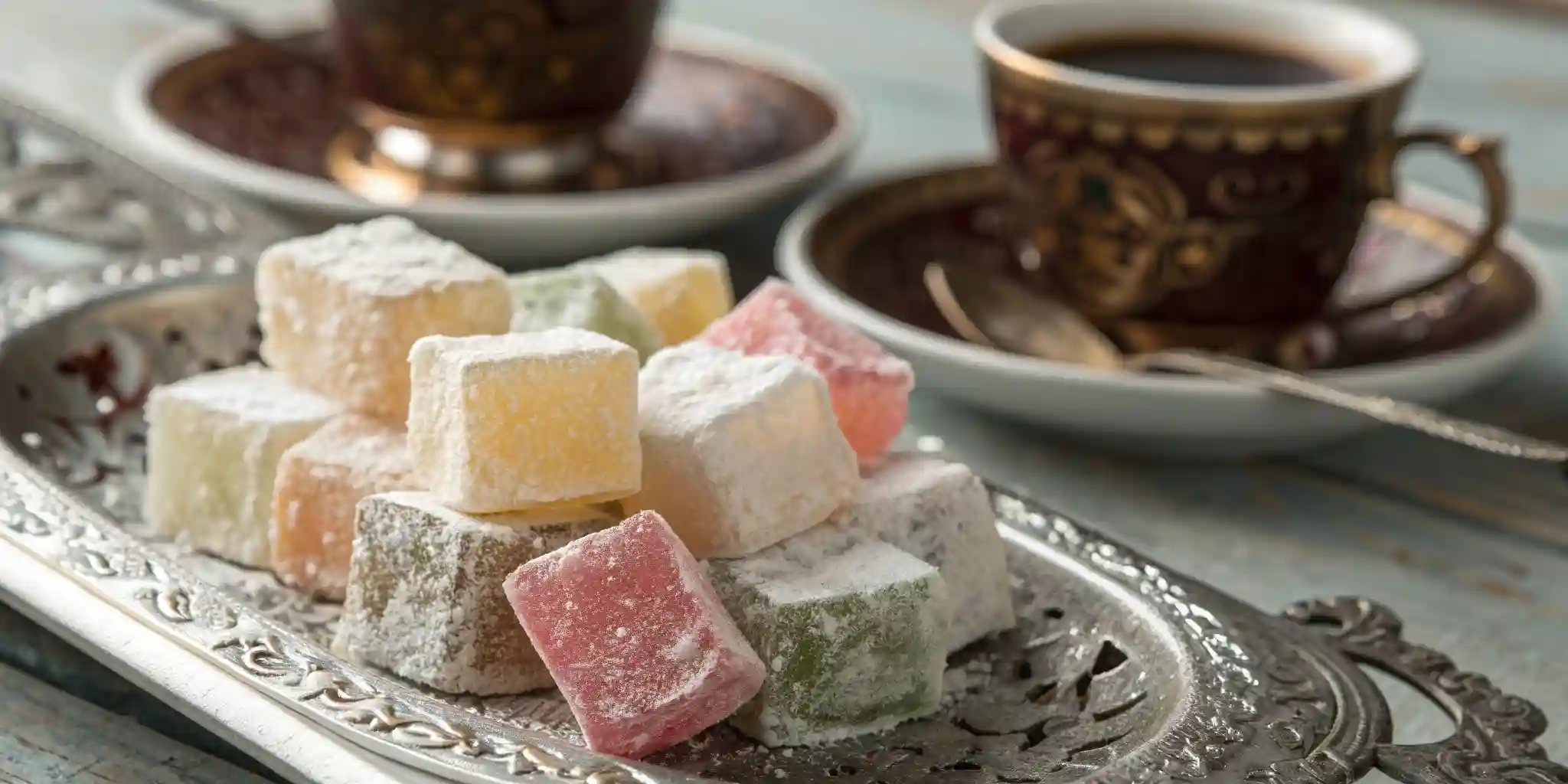 Assorted Turkish Delight cubes served with Turkish coffee.